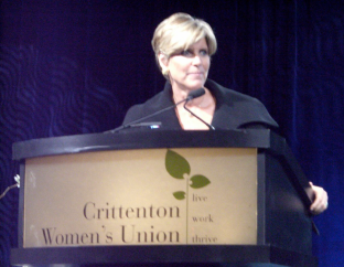 Suze Orman Speaking at Podium