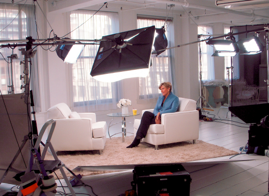 Suze Orman Sitting on Couch