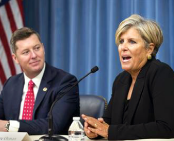 Suze talking into microphone