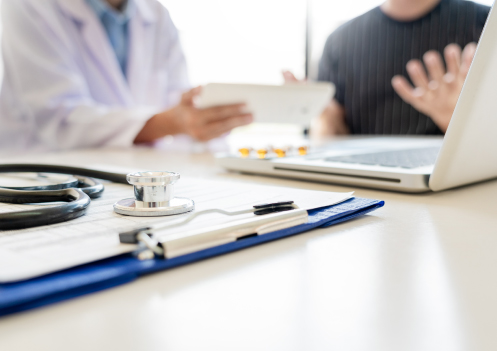 doctor showing patient a form