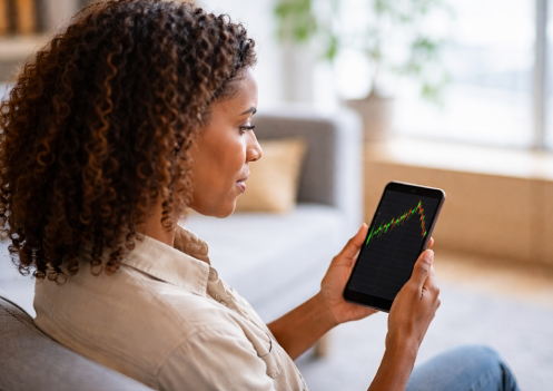 woman looking at stock on her phone