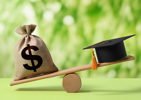 scale weighing money and grad cap